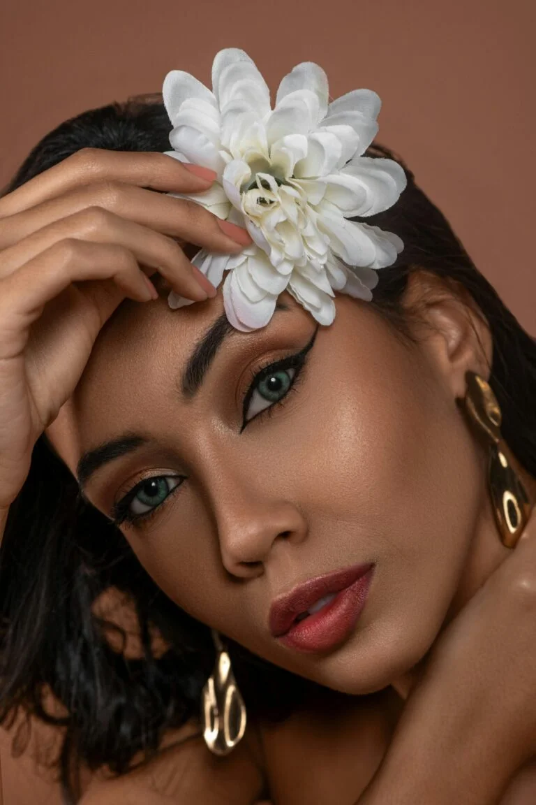 Woman with flower and earrings.